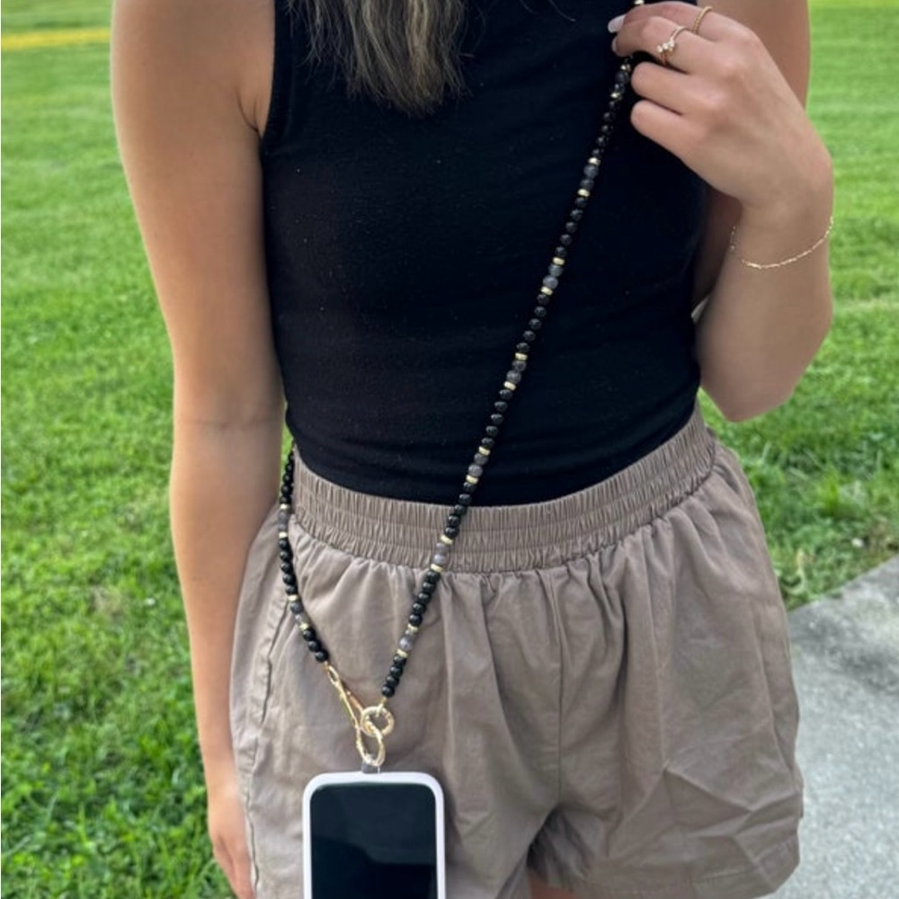 Save The Girls Elegant Black and Gold Beaded Phone Necklace